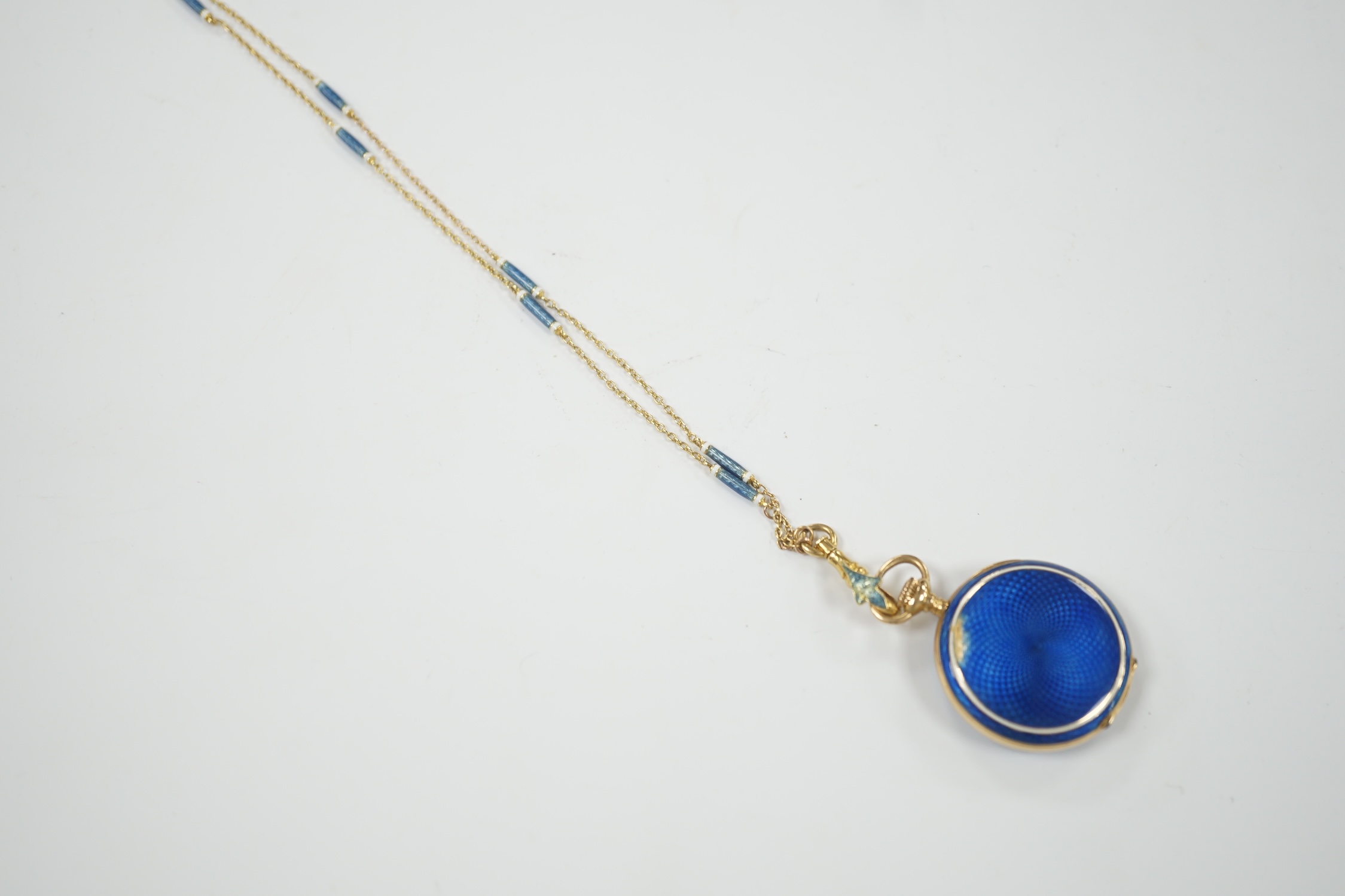 An early 20th century continental 15ct gold and enamel open face fob watch, on an 18ct and two colour enamel chain, 64cm, gross weight 26.5 grams (enamel a.f.).